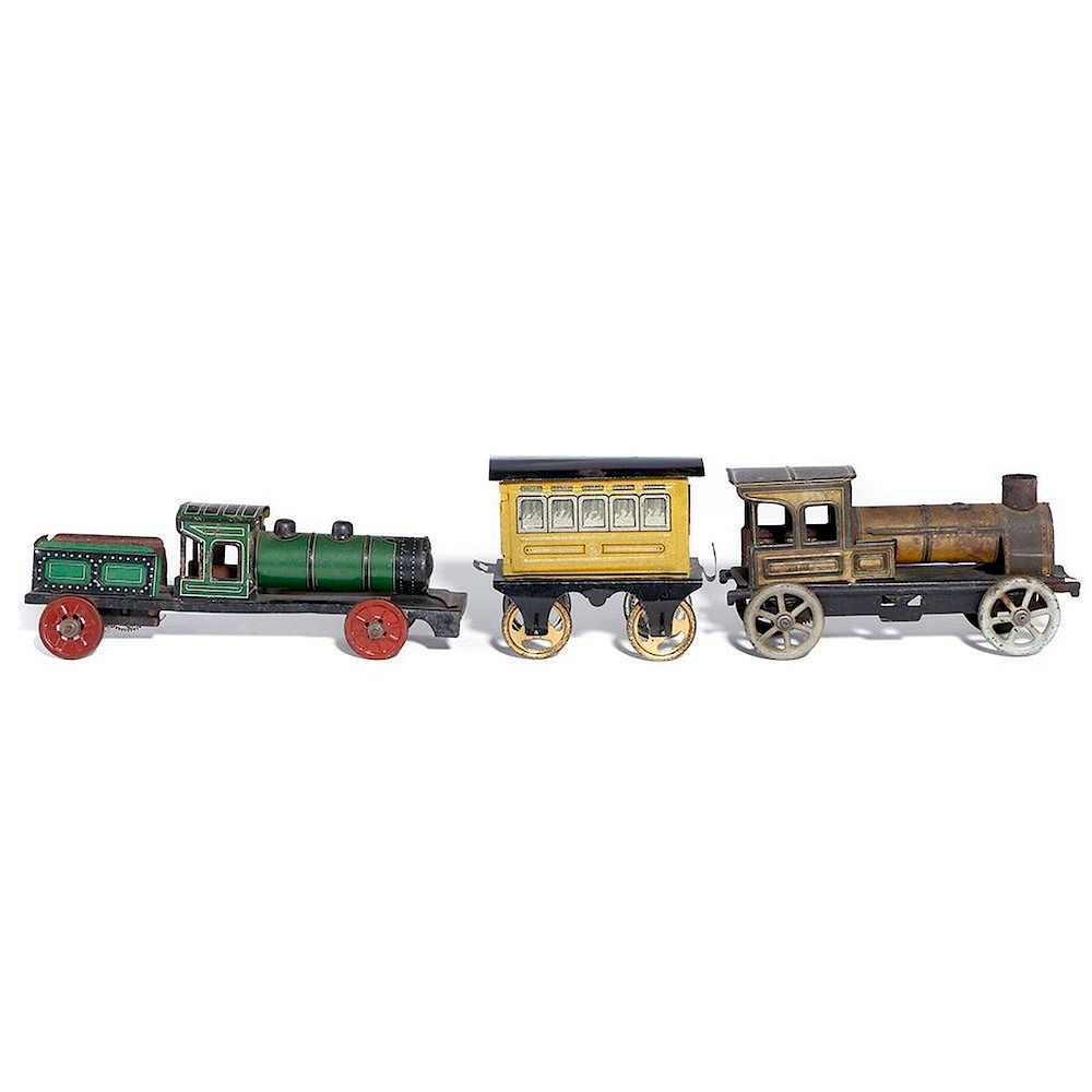 Appraisal: Floor toy train grouping Selection of three toys by Issmayer