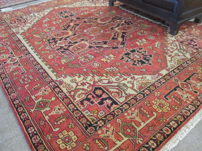 Appraisal: HAND KNOTTED ORIENTAL CARPET Persian Serapi design central geometric medallion