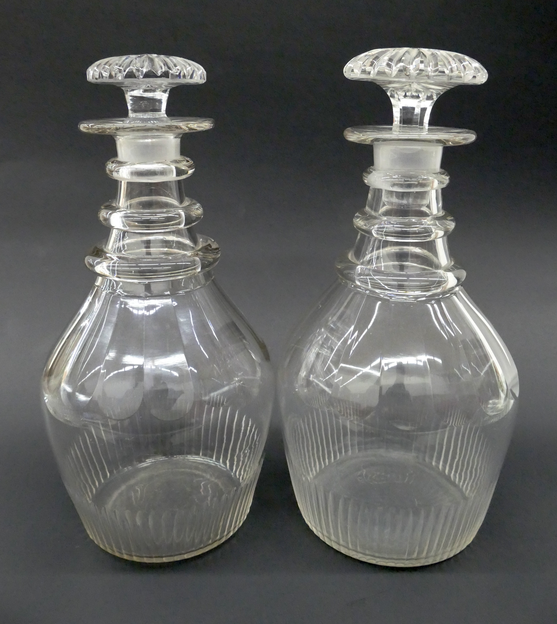 Appraisal: Pair Georgian Panel Cut Crystal Decanters c Fluted base and