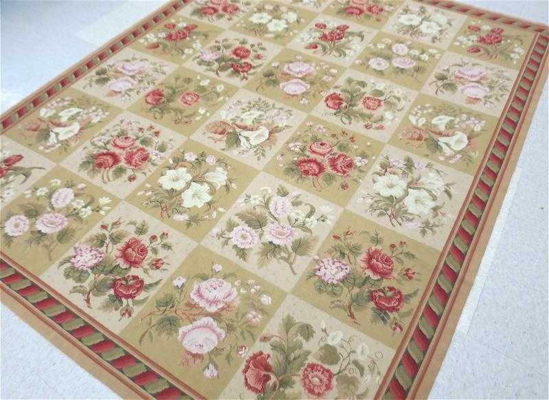 Appraisal: HANDMADE NEEDLEPOINT CARPET repeating floral panel design ' x '