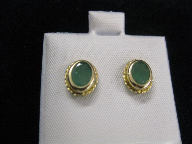 Appraisal: Emerald Earrings oval gems in k yellow gold pierced settings