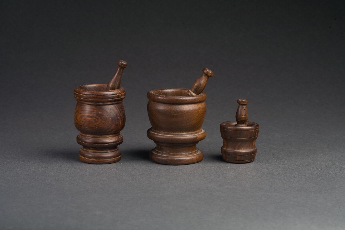 Appraisal: THREE LIGNUM VITAE MORTAR AND PESTLES Height of tallest inches