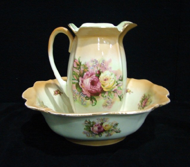 Appraisal: A Victorian bowl and pitcher enriched with roses on a