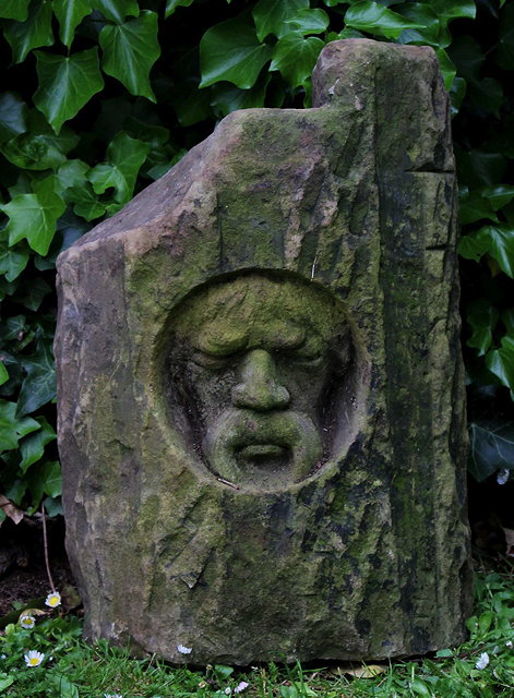 Appraisal: AN ARCHITECTURAL STONE FRAGMENT with an inset hand carved face