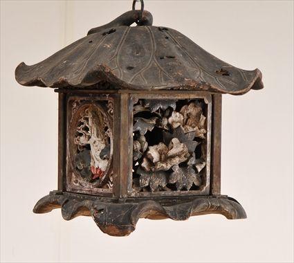 Appraisal: JAPANESE POLYCHROME CARVED WOOD HANGING LANTERN The lotus-leaf top over