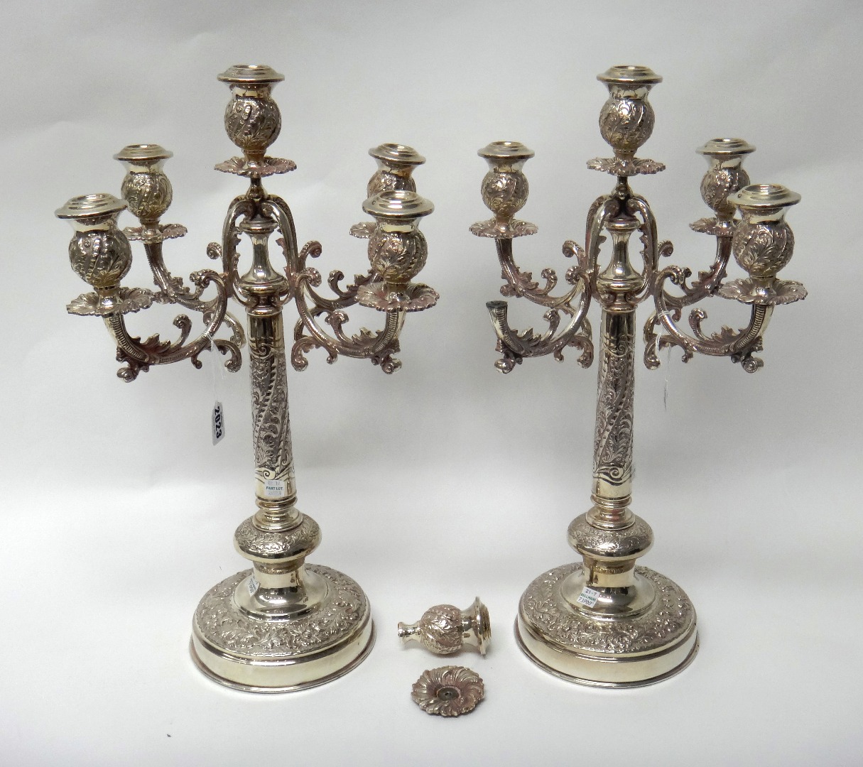 Appraisal: A pair of plated five light table candelabra having scrolling