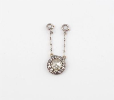 Appraisal: A diamond cluster pendant The pear shaped rose cut diamond