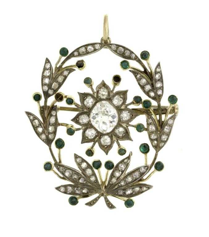 Appraisal: AN EMERALD AND DIAMOND GARLAND PENDANT the central flower cluster