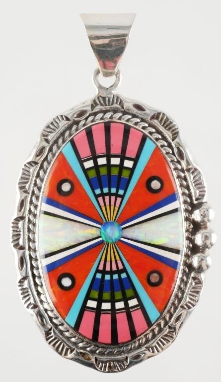 Appraisal: NATIVE AMERICAN STYLE MOSAIC PENDANTSterling silver pendant with ornate designs