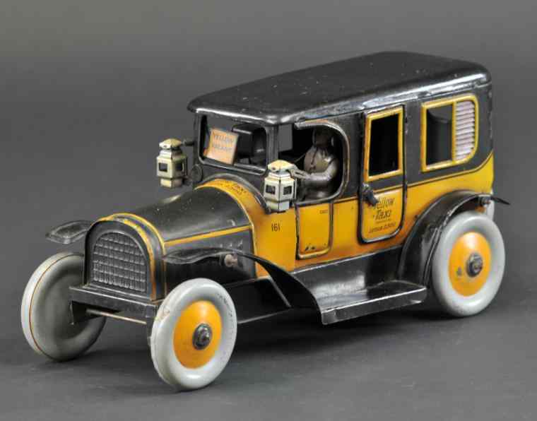 Appraisal: KARL BUB YELLOW TAXI Germany scarce example lithographed tin done