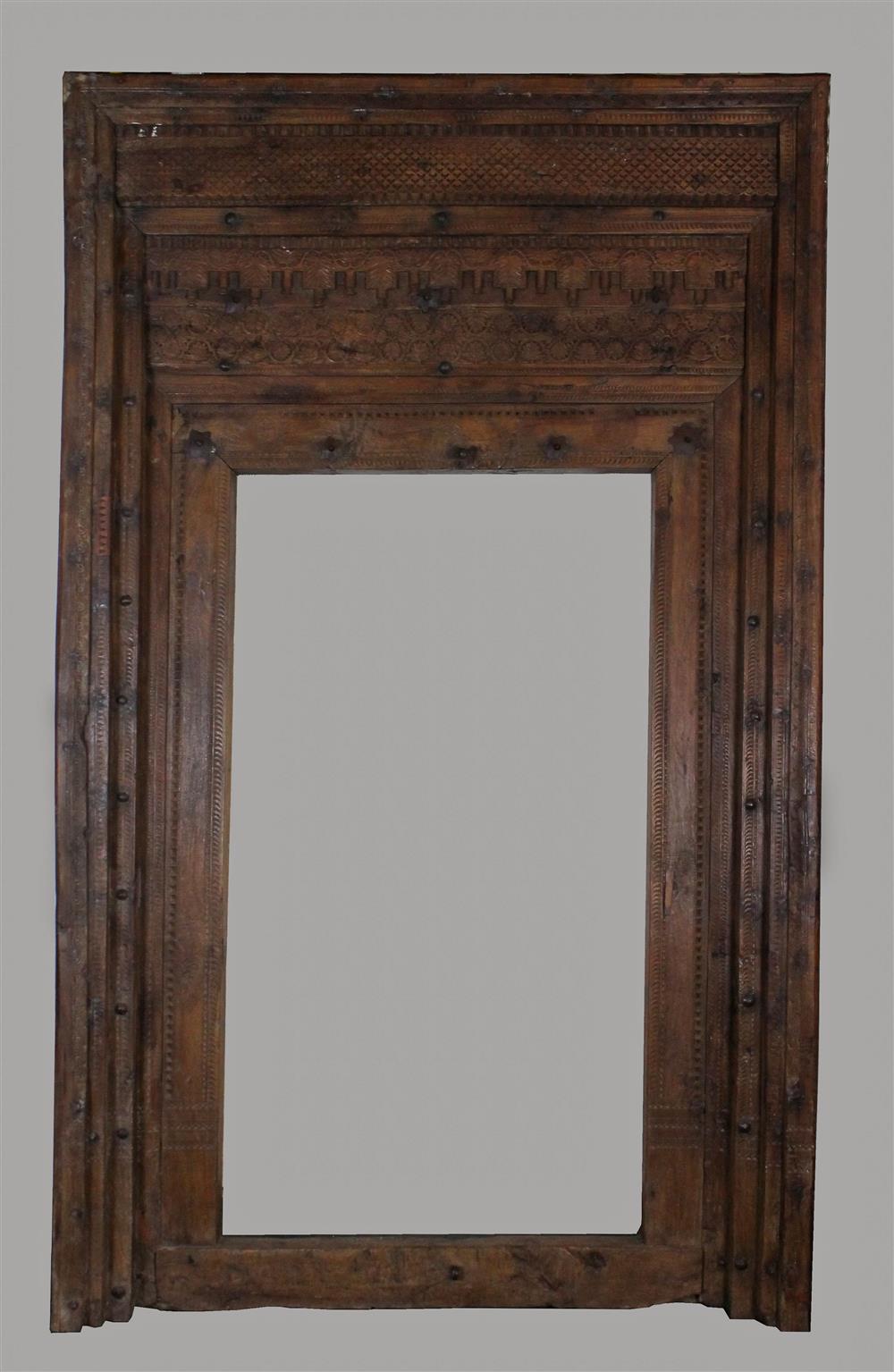 Appraisal: MONUMENTAL ZANZIBAR STYLE HAND CARVED DOOR SURROUND ornately carved frame