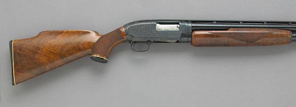 Appraisal: A custom engraved gauge Winchester Model slide action shotgun Serial