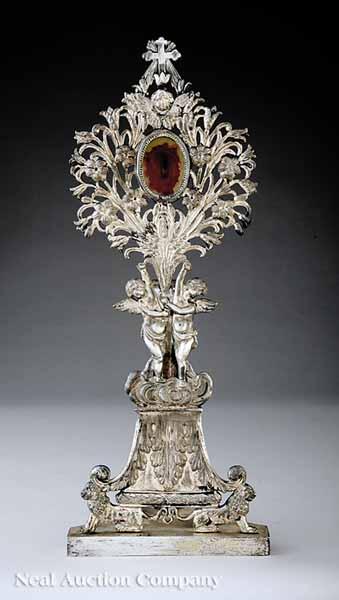 Appraisal: An Antique Continental Silverplate Reliquary surmounted by a cross featuring