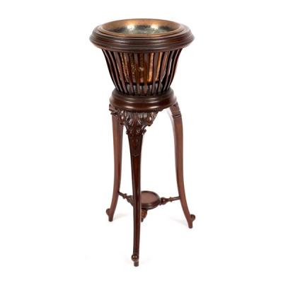 Appraisal: An Edwardian mahogany slatted jardini re stand on three cabriole