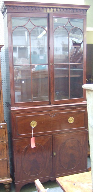 Appraisal: A George III mahogany secretaire cabinet the split turned decorated