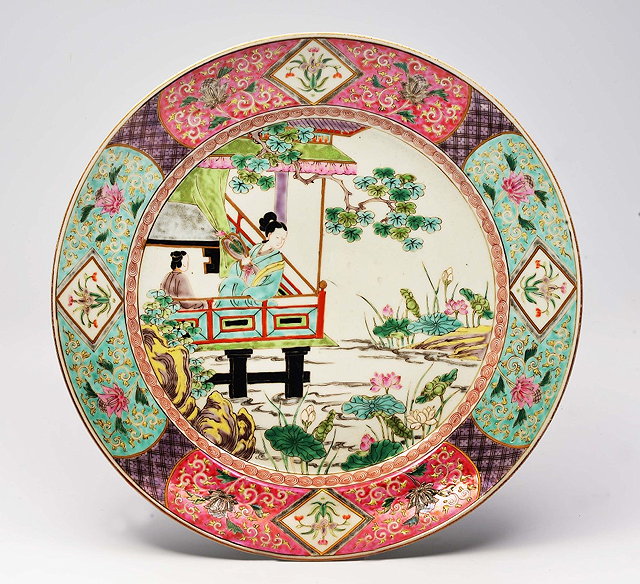 Appraisal: A CHINESE FAMILLE ROSE CIRCULAR CHARGER the centre decorated in