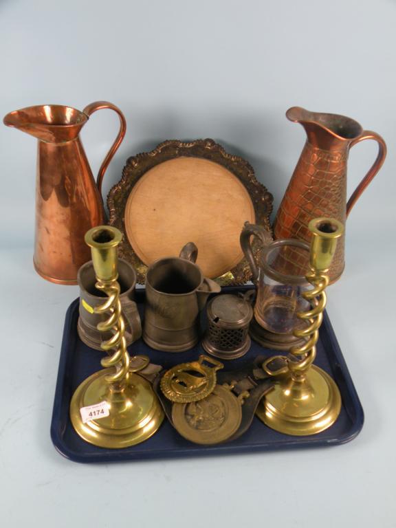 Appraisal: A pair of brass spirally fluted candlesticks a thC pewter