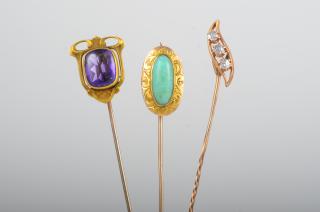 Appraisal: Three Stick Pins Three gold and gemstone stick pins one