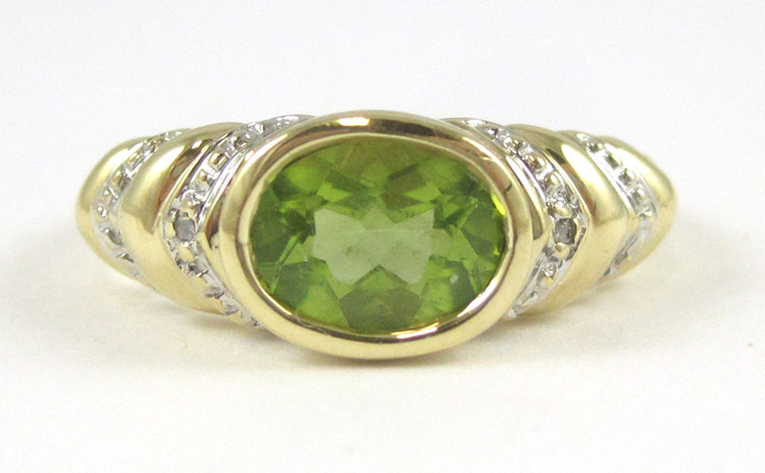 Appraisal: PERIDOT DIAMOND AND TEN KARAT GOLD RING set with two