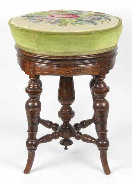 Appraisal: An Edwardian adjustable piano stool the needlework seat above turned