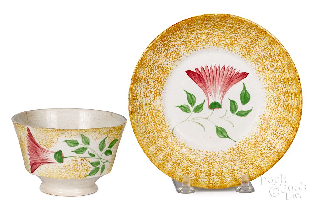 Appraisal: Yellow spatter thistle cup and saucer Yellow spatter thistle cup