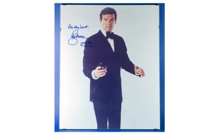 Appraisal: James Bond Framed Poster signed by Roger Moore measuring by