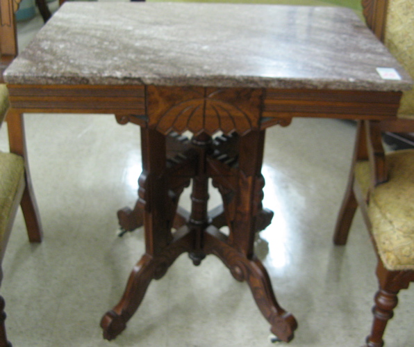 Appraisal: A VICTORIAN MARBLE-TOPPED LAMP TABLE Eastlake design American c having