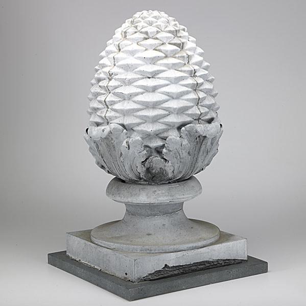 Appraisal: ARCHITECTURAL ELEMENTZinc pineapple mounted on faux marble base th c