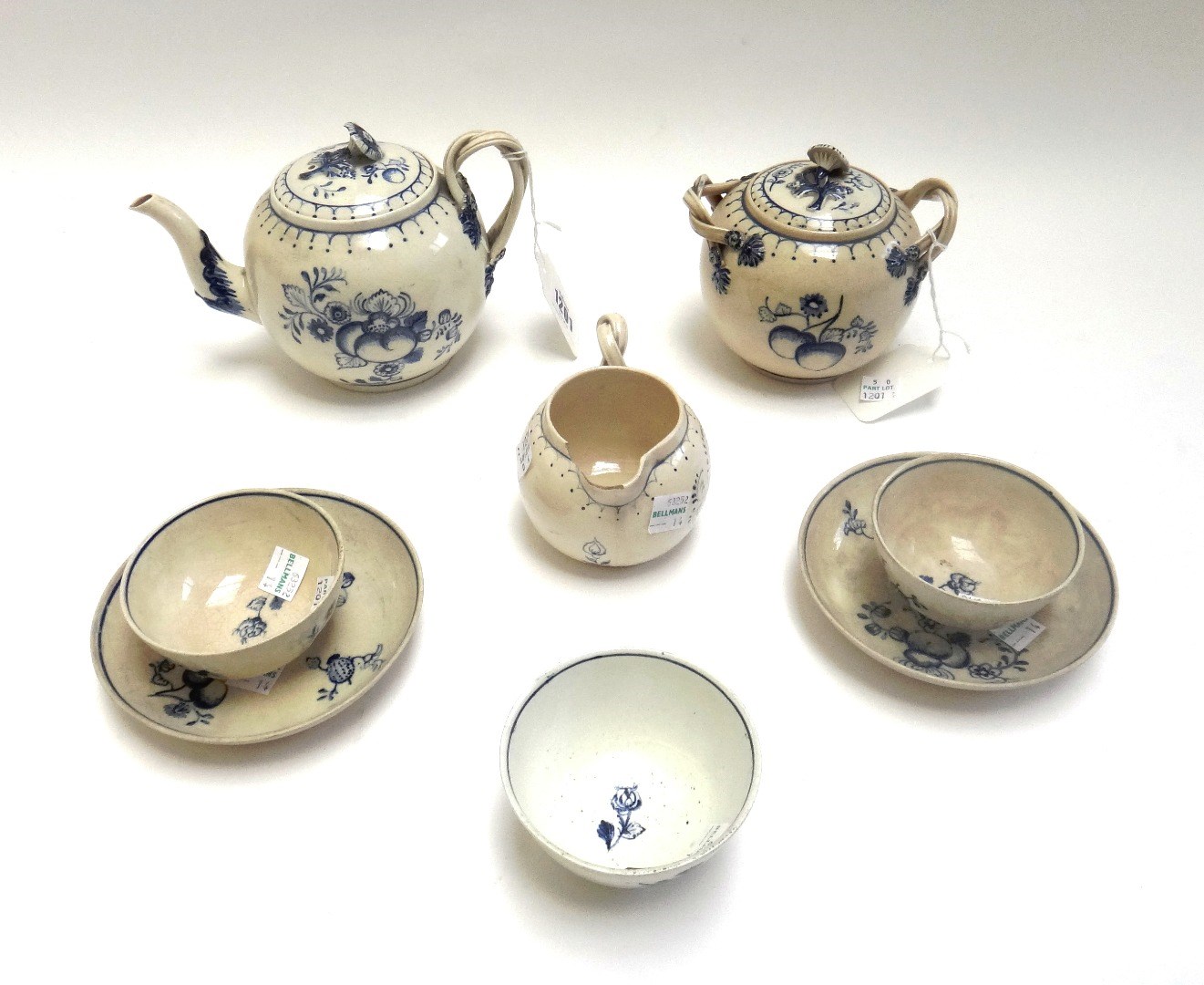 Appraisal: An earthenware blue and white part tea service in th