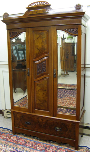 Appraisal: A WALNUT AND BURL WALNUT WARDROBE English early th century