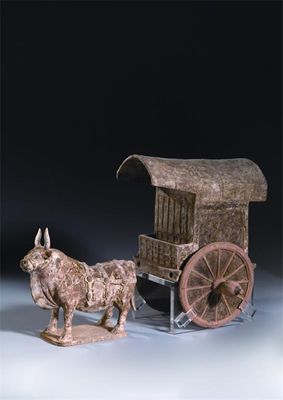 Appraisal: A Chinese unglazed pottery model of an ox and cart