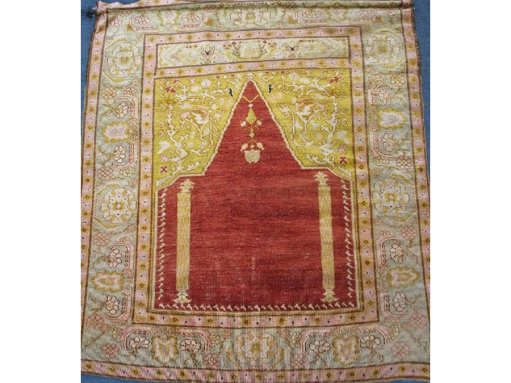 Appraisal: A BRUSSA SILK PRAYER RUG with central red mihrab against