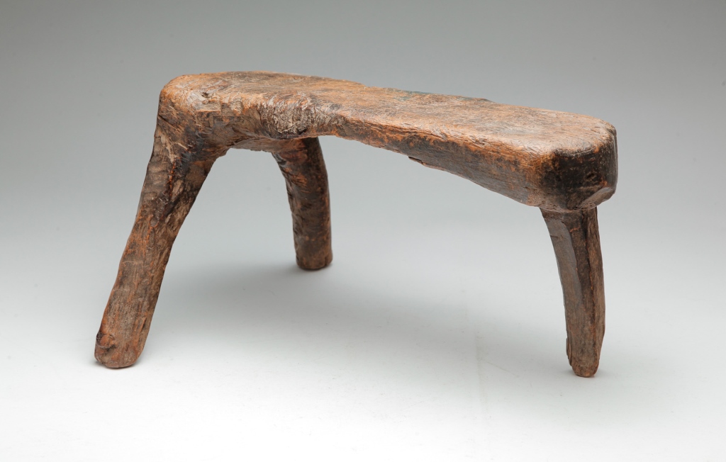 Appraisal: Late th-early th century Rough hewn three-legged root stool with