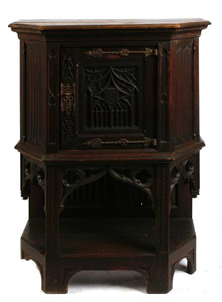 Appraisal: A Gothic Revival carved oak side cupboard height in width