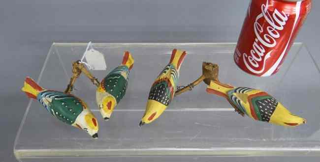 Appraisal: Two boughs of early th c polychrome carved birds on