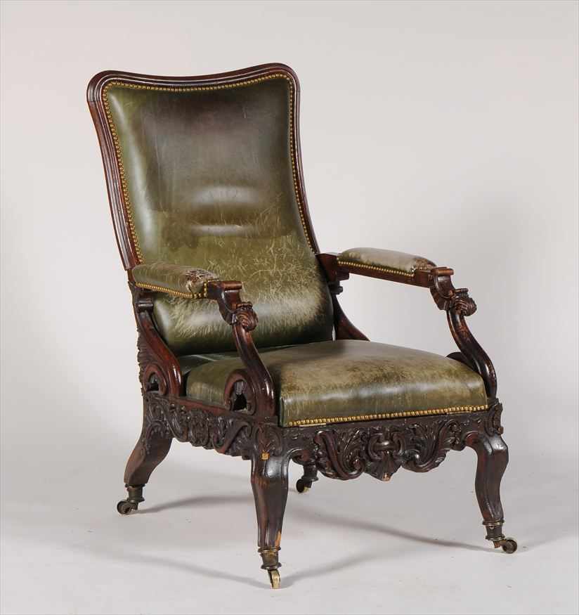 Appraisal: VICTORIAN STAINED OAK AND LEATHER ARMCHAIR With a tall upholstered