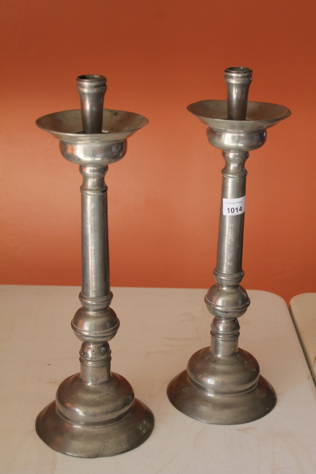 Appraisal: A pair of Portugese pewter candlesticks cm high