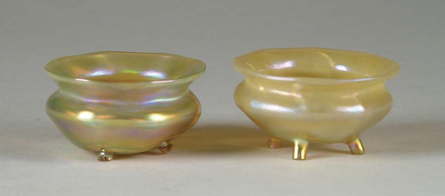 Appraisal: TWO TIFFANY FOOTED GLASS SALTS Gold Favrile glass cauldron shaped