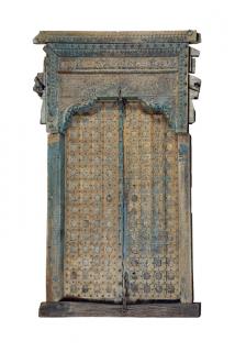 Appraisal: AN INDIAN STYLE DISTRESSED TEAK DOOR AND OVER-ARCH The imposing