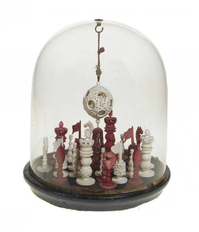 Appraisal: A CHINESE IVORY CHESS SET stained red and natural kings