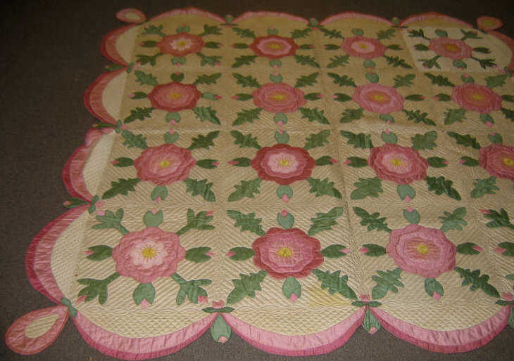 Appraisal: AMERICAN 'ROSE APPLIQUE' QUILT Pink flowers with green foliate and