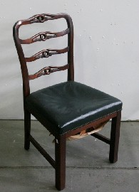 Appraisal: A single chair with ladder back and green leather upholstered