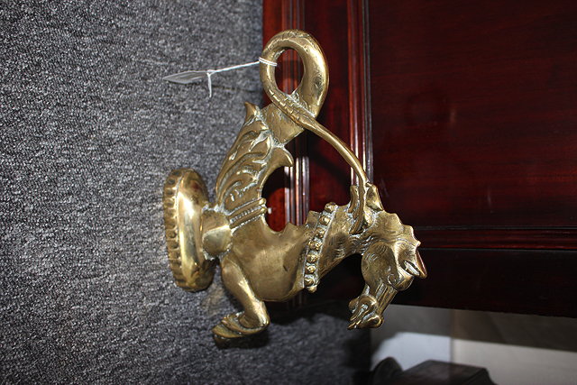 Appraisal: A BRASS DOOR STOP OR PORTER in the form of