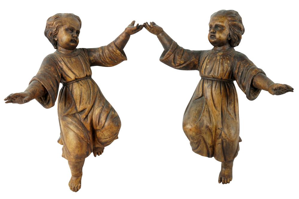 Appraisal: PAIR OF WOOD CARVED CHERUBSCondition with loss to foot on