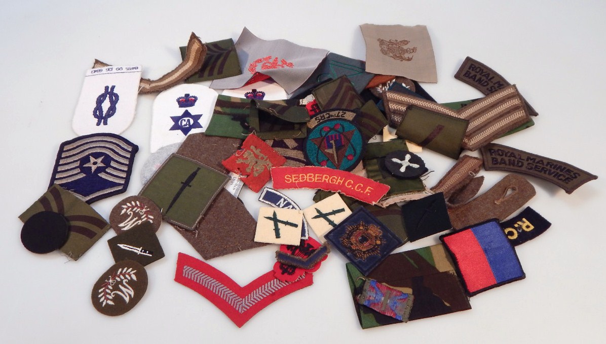 Appraisal: Various army related and other cloth and iron on badges