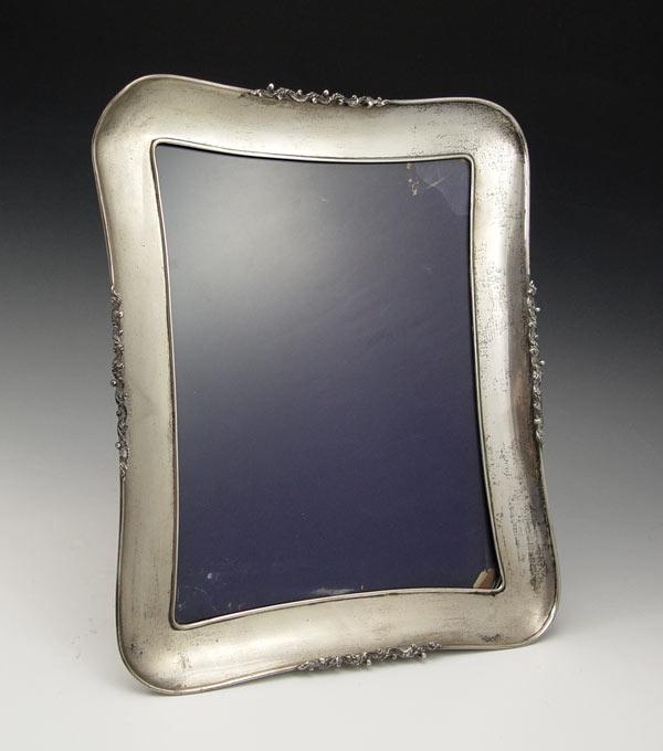 Appraisal: FINE SILVER EASEL BACK PICTURE FRAME Applied decoration Illegible makers