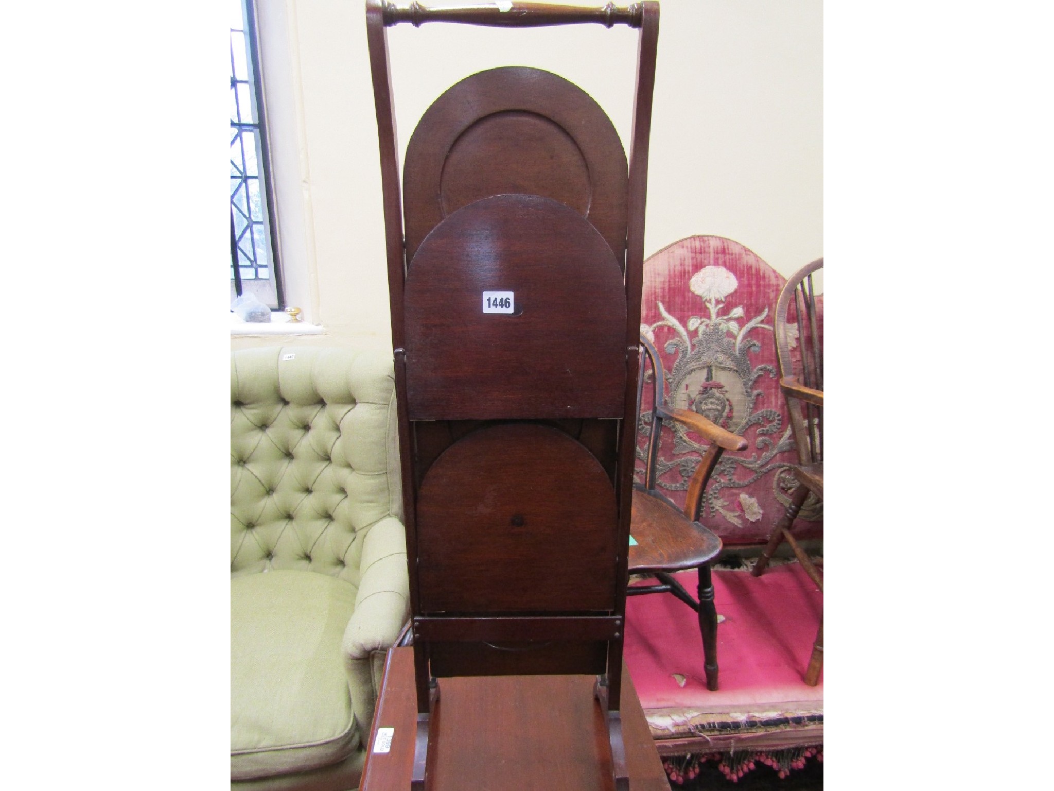 Appraisal: An Edwardian mahogany folding cake stand fitted with four Demilune