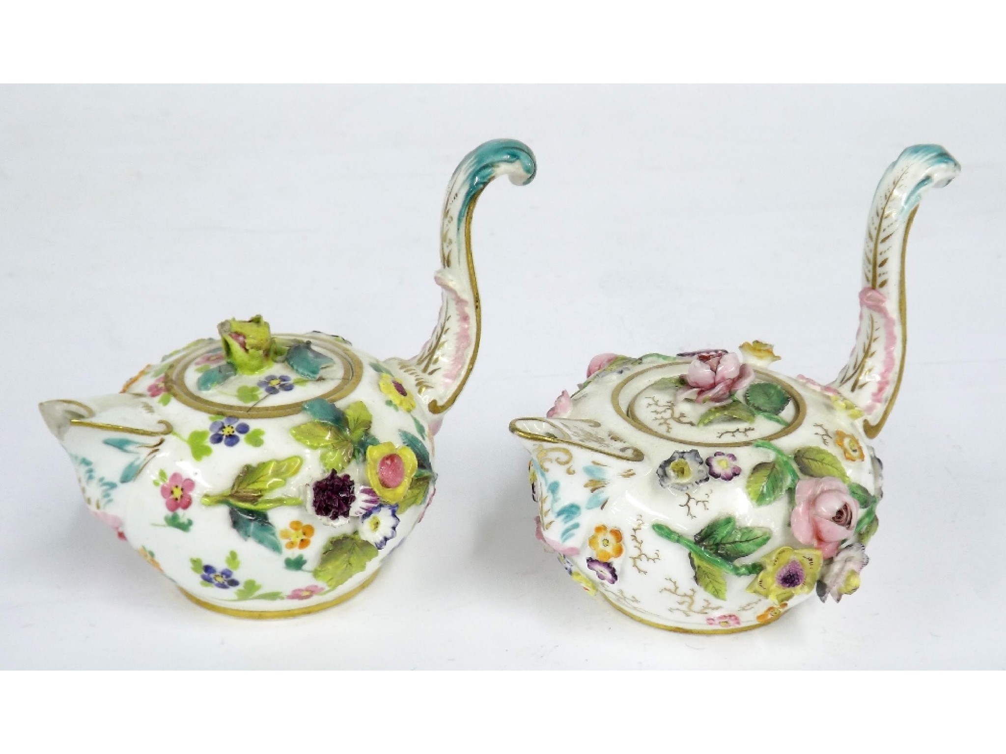 Appraisal: Pair of th century porcelain teapots in the style of