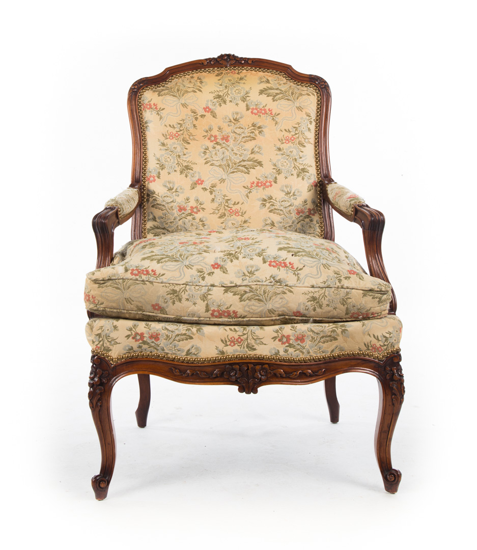 Appraisal: Louis XV style carved walnut upholstered fauteuil floral carved exposed