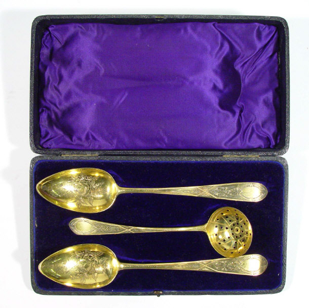 Appraisal: Cased pair of gold plated metal table spoons the bowls